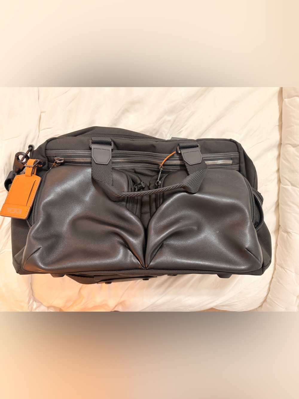TUMI Black Duffel Bag with TAN Luggage Tag